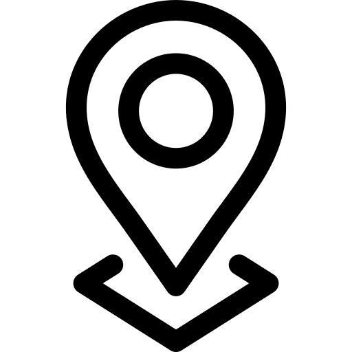 A person in a wheelchair uses a ramp to enter a building, highlighting accessibility for individuals with disabilities.